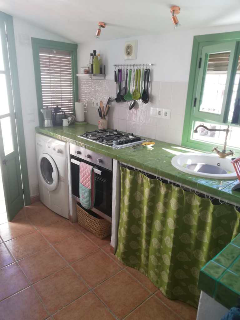 Fully equiped kitchen leading out onto sun terrace